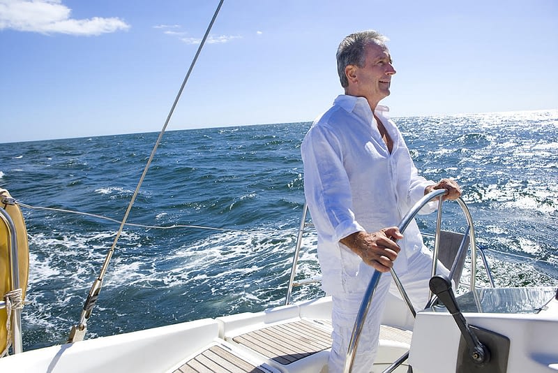 Retired Man Driving Yacht
